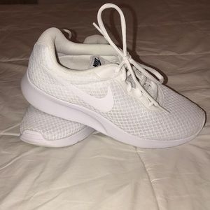 White Nike tennis shoes.